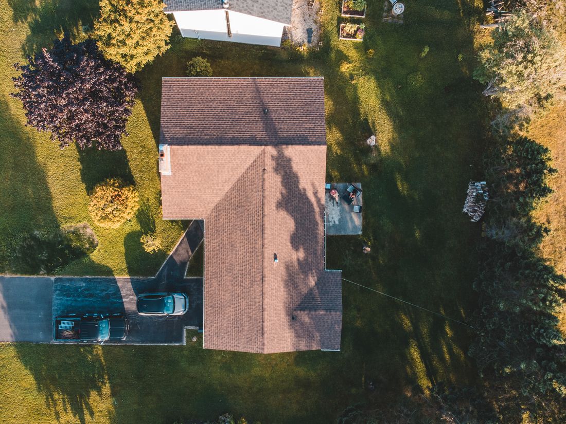 Top-down drone photo of a house with its lawn outlined